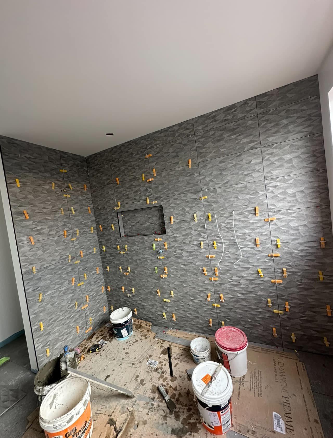 Feature wall tiling in progress