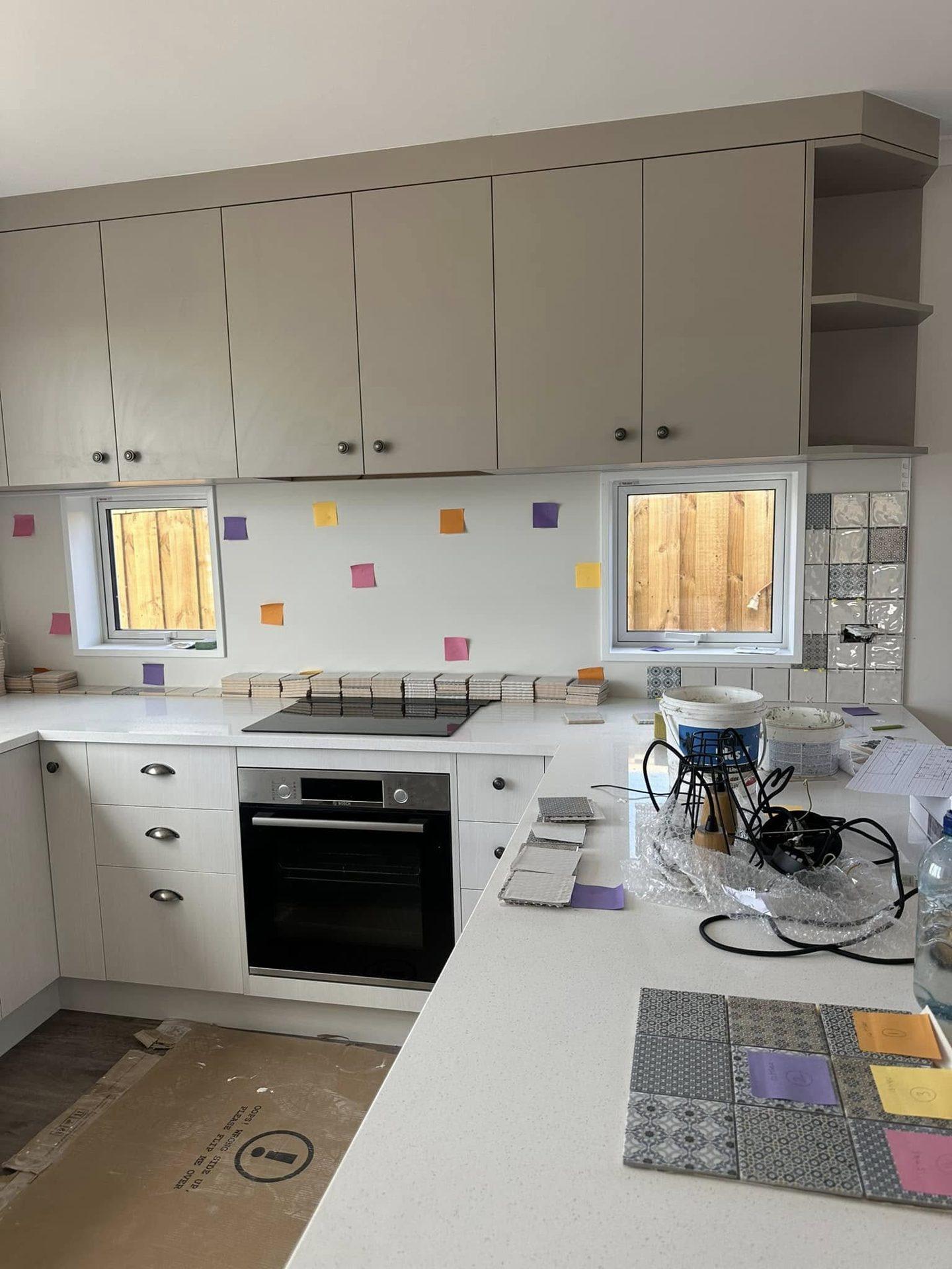 Kitchen splashback tile layout planned with samples