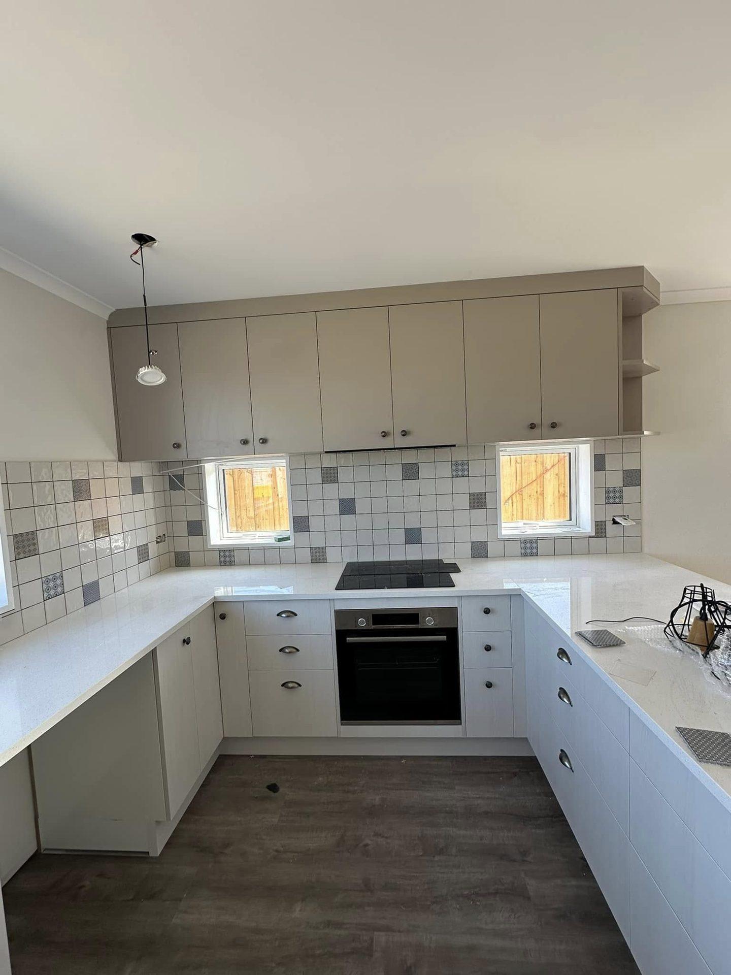 Patterned patchwork tile kitchen splashback